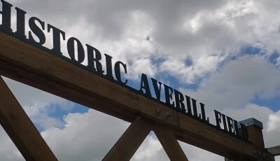 Historic Averill Field sign with cloudy sky in Washington State.